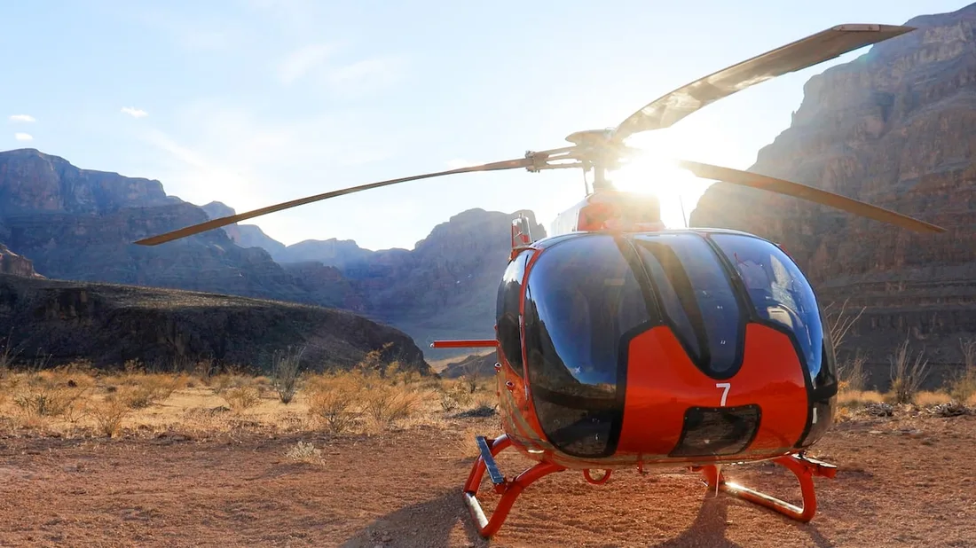 A helicopter above the red walls of the Grand Canyon West Rim